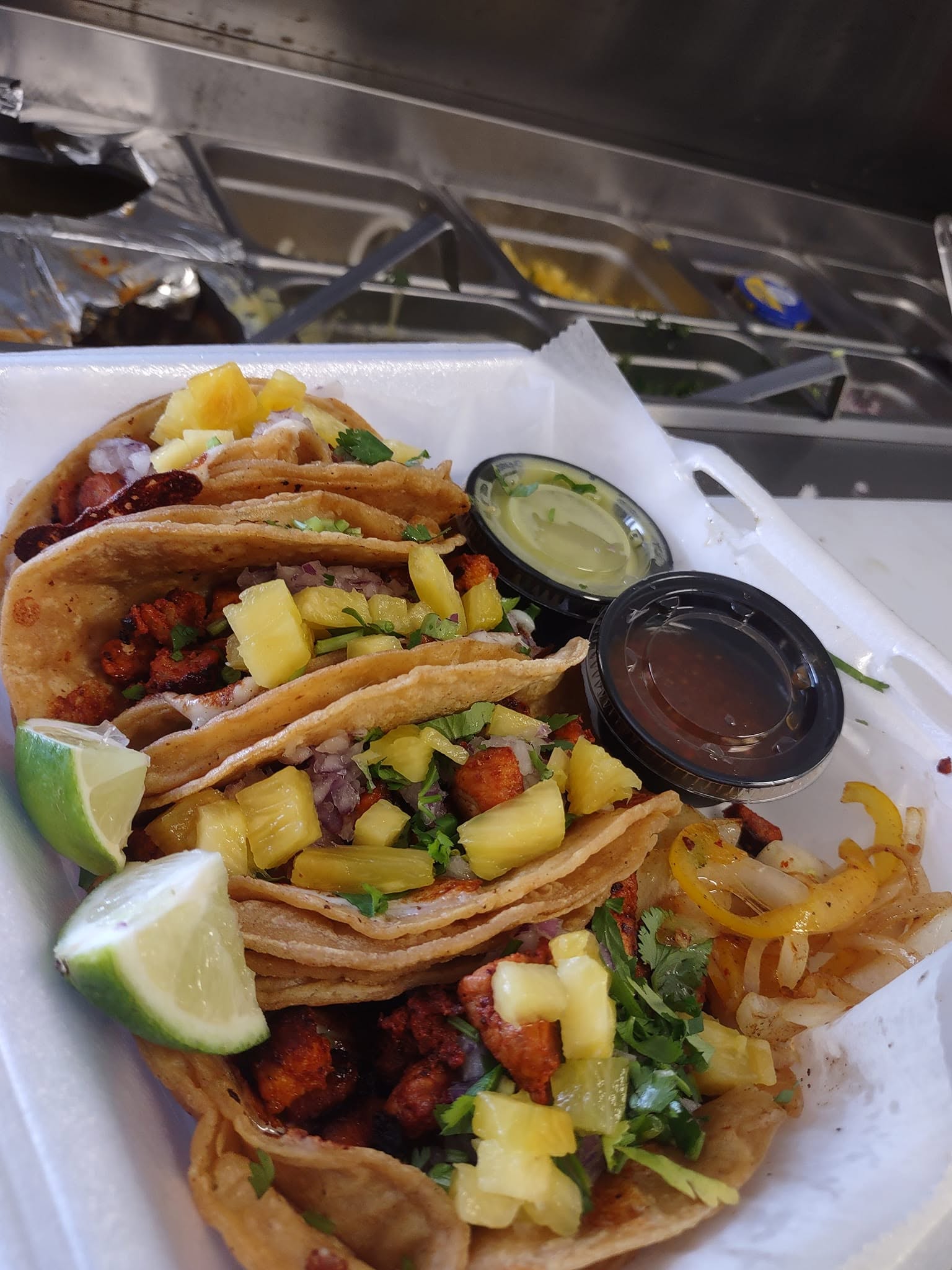 Fresh pineapple-topped street tacos