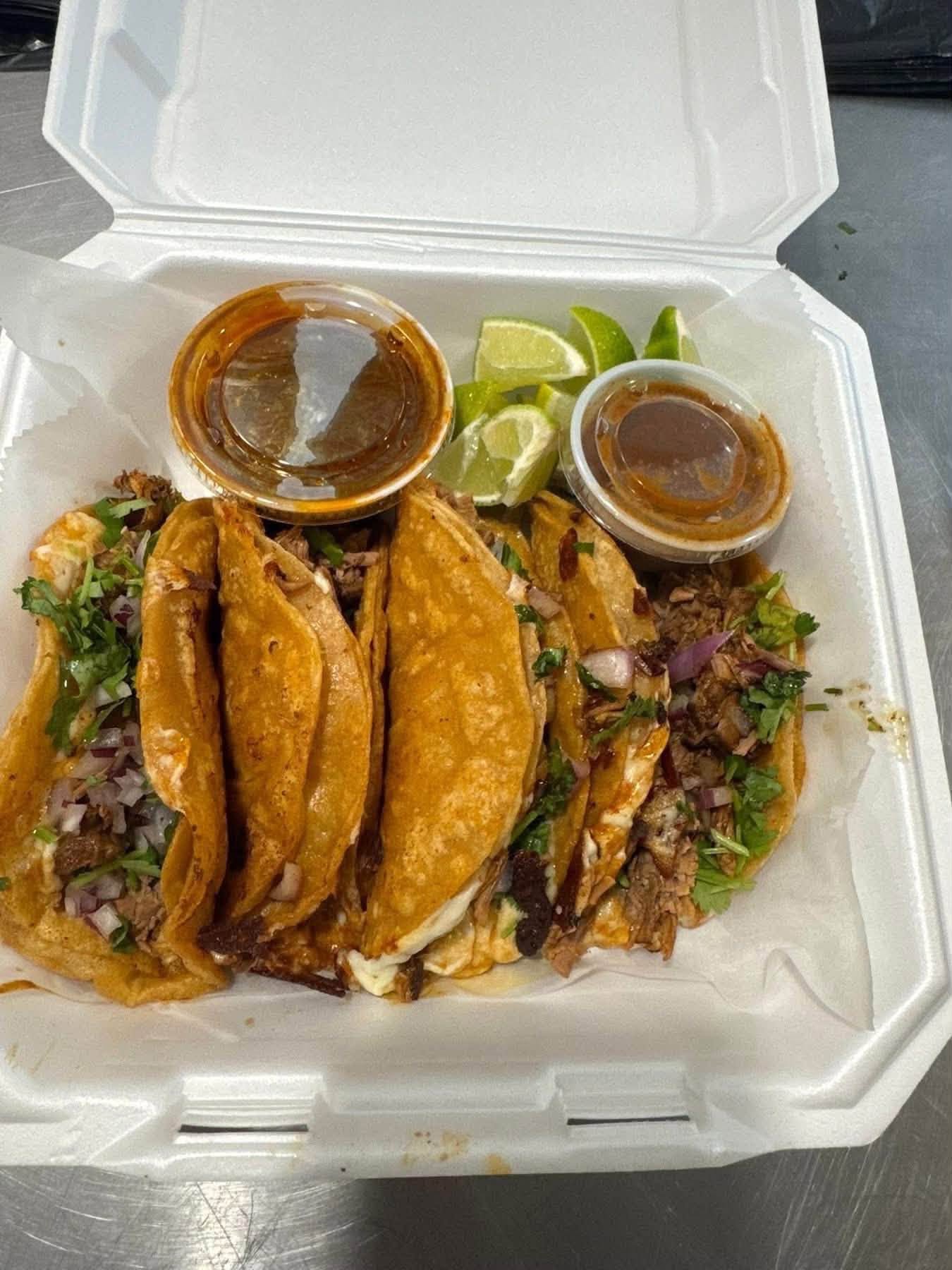 A full box of golden tacos